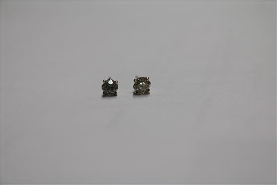A pair of 18ct white gold and solitaire diamond ear studs, no butterflies.